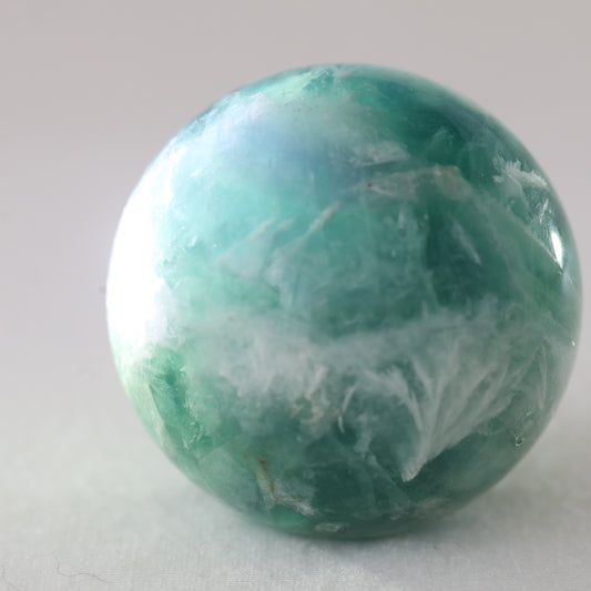 Feather Flourite Sphere 302GM - Sentient Crystals - stone type - stone keywords