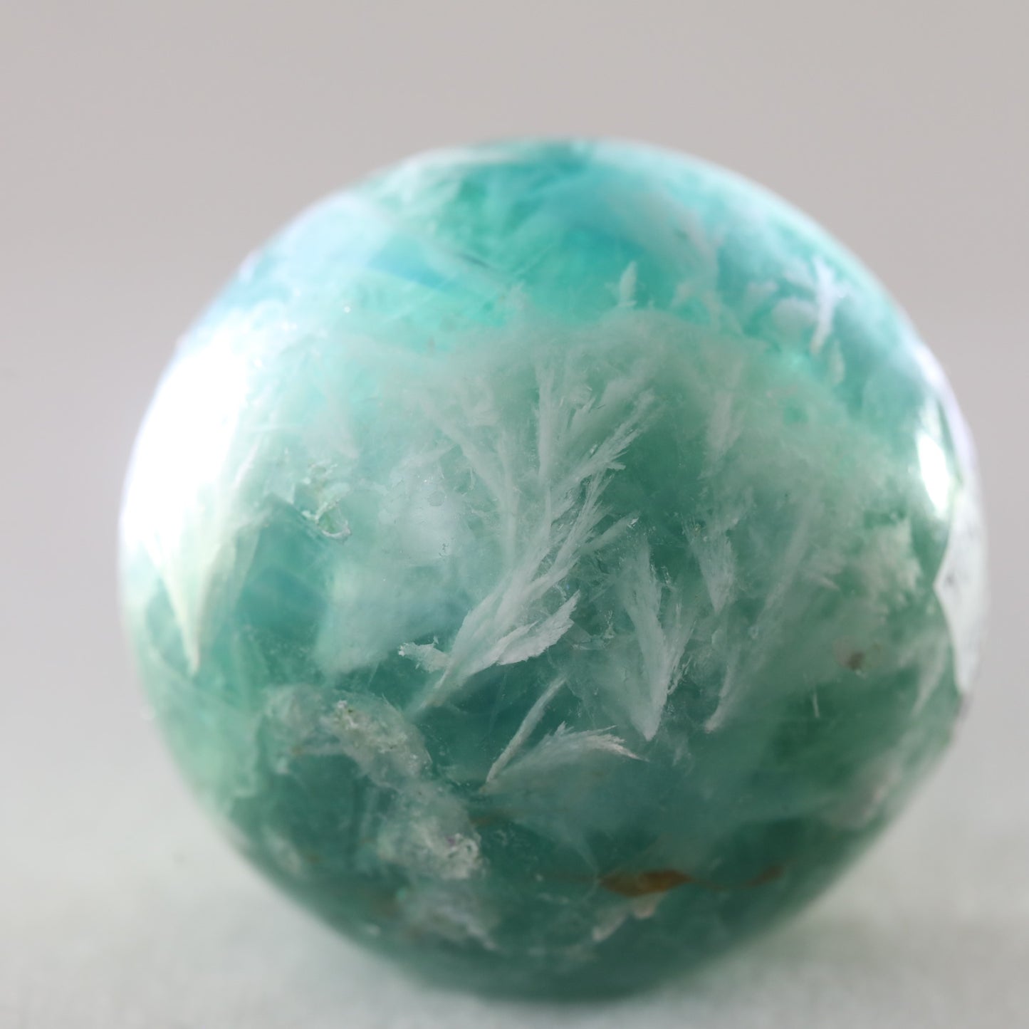Feather Flourite Sphere 302GM - Sentient Crystals - stone type - stone keywords