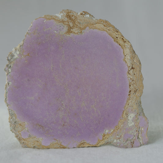Phosphosiderite slab displaying soft lavender-purple hues and a smooth polished surface, symbolizing calmness, spiritual growth, and emotional healing