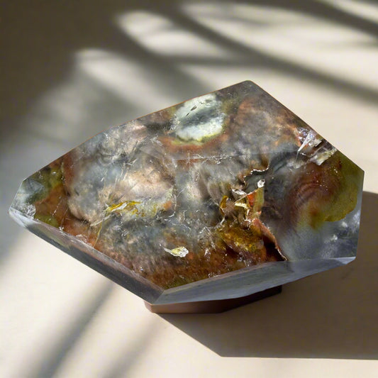 Blue Tara freeform crystal with deep blue and gray tones, showcasing natural patterns that symbolize peace, intuition, and spiritual strength