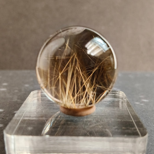 smokey quartz sphere with rutile well polished with transperant base