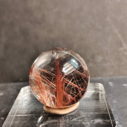 red rutile quartz with transperant base in black background