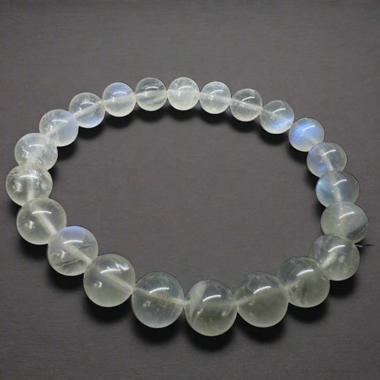 white rainbow moonstone bracelet on based black ceramic