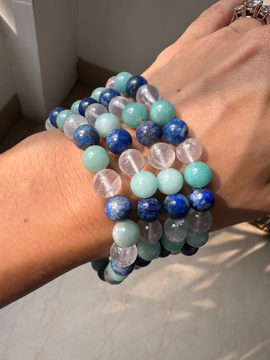 Communication crystal bracelet made with soothing blue and clear stones, promoting clarity, confidence, and expressive communication.