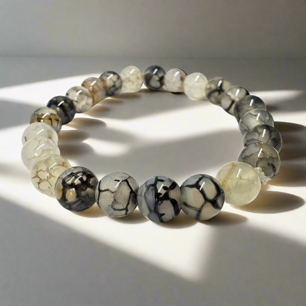 Dragon Vein Agate bracelet featuring translucent beads with crackled vein patterns, symbolizing strength, vitality, and protection