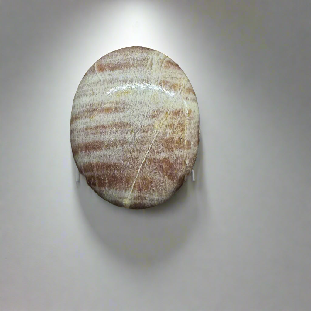 A Multi Moonstone Palm Stone with Striations of Blue, White, and Peach Colors