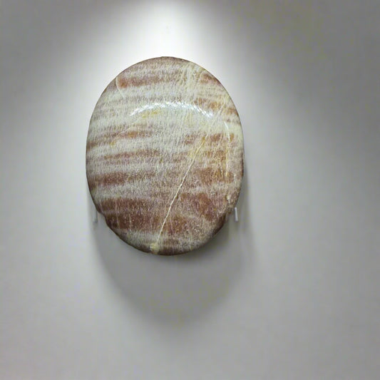 A Multi Moonstone Palm Stone with Striations of Blue, White, and Peach Colors