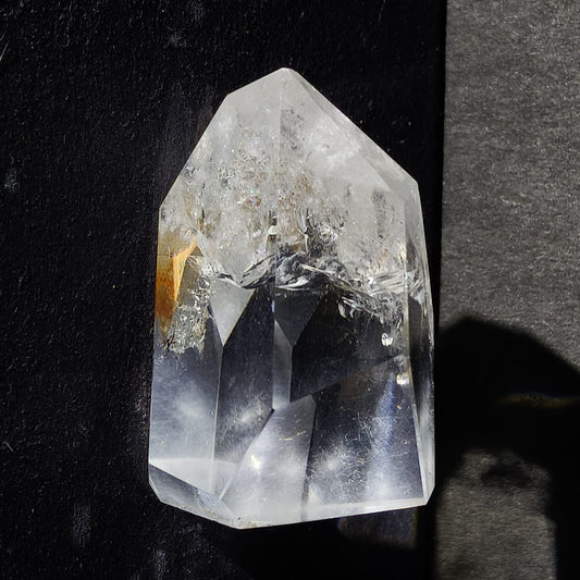 Clear crystal prism on a black background