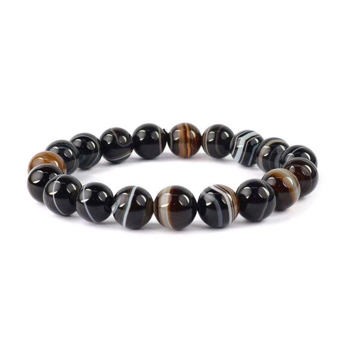 Beaded bracelet with black, brown, and white stones on a white background